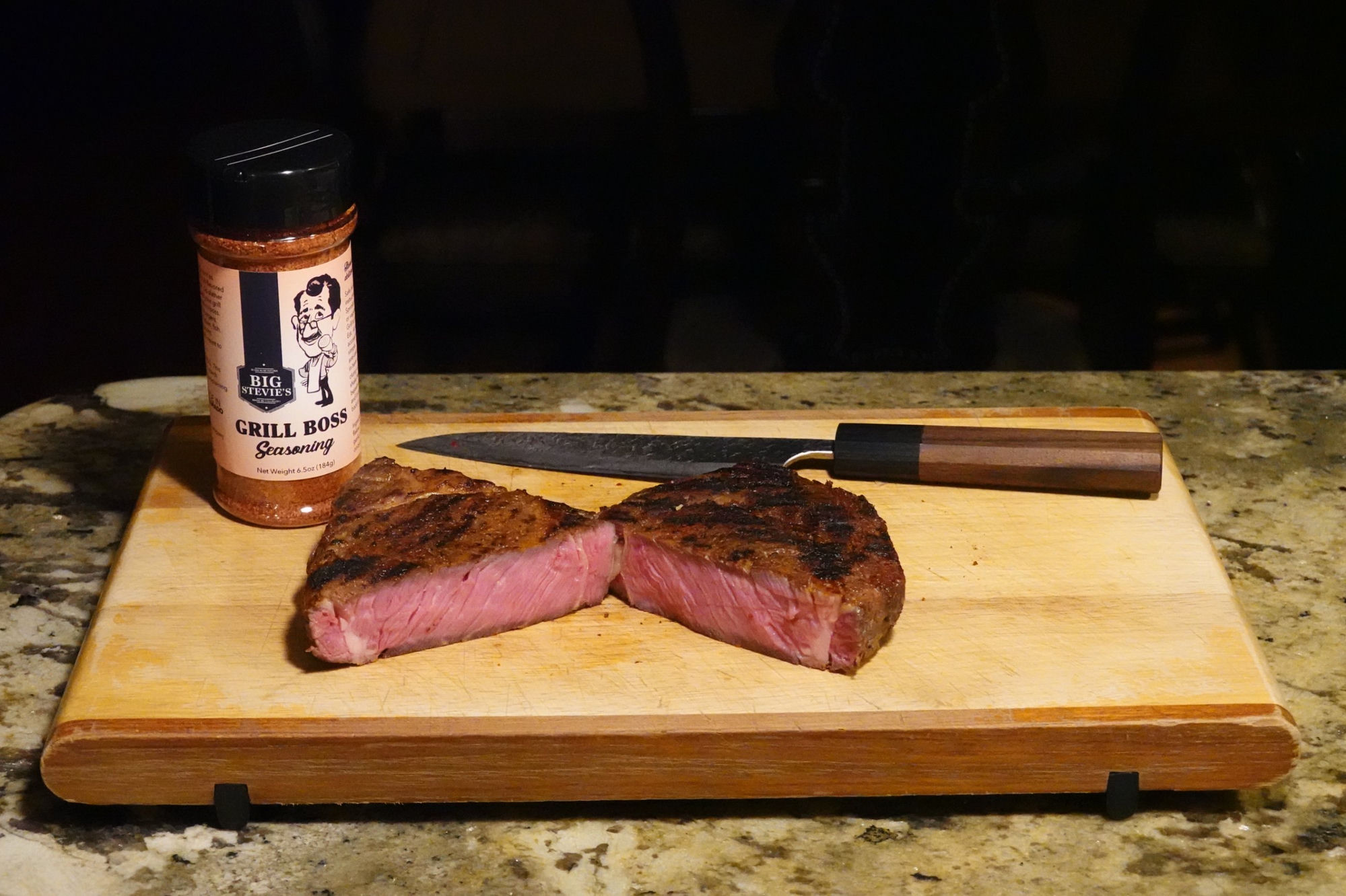 Grilled steak on cutting board